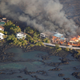 Image for article titled New aerial photos show Kilauea’s lava devouring neighborhoods